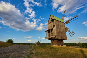 Old Ukrainian windmill under dramatic skies