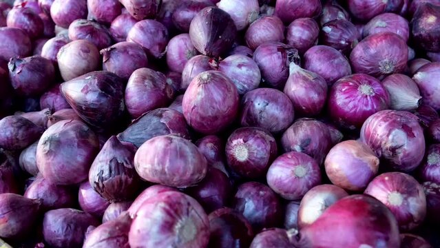 Purple medium-sized red onion on display at the open space public market in Davao City, the Philippines.