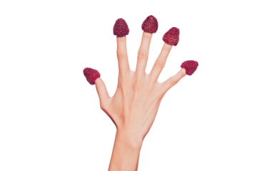 Close-up croopped delicate well-groomed hand five fingers sweet berries hats on nails isolated over pink pastel background