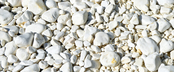 White pebbles texture background, decorative small stones texture
