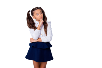 Nice cute dreamy adorable lovely stylish girl with curly pigtails in white blouse shirt and dark blue shirt skirt, thoughtful gesture, hand fist to chin, copy-space. Isolated over grey background