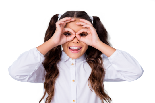 Portrait of nice cute funky cheerful adorable lovely stylish playful small, little girl with curly ponytails in white formal blouse shirt, showing ok-signs like glasses. Isolated over grey background