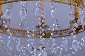 A beautiful chandelier decorated with clear crystals.