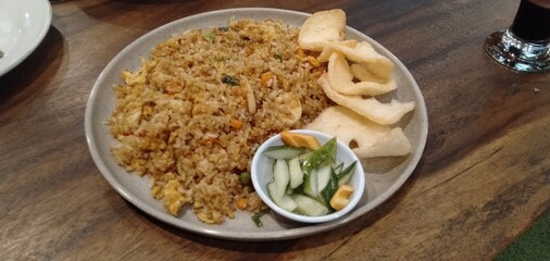 Asian fried rice fried rice with chicken  prawns and fish balls from indonesian