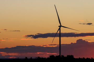 Silhouette of large wind turbine at sunset, Australian Outback, near Wiluna, Western Australia