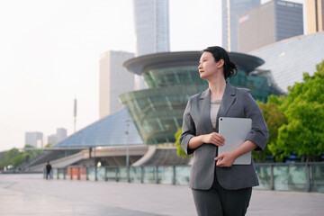 Confident Businesswoman in an Urban Setting at Dusk