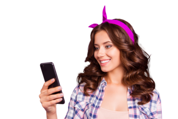 Half turn portrait of pretty charming cheerful carefree careless lady with her hairstyle she isolated on bright purple background hold gadget in hand look on screen receive send sms