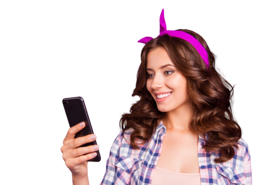 Half turn portrait of pretty charming cheerful carefree careless lady with her hairstyle she isolated on bright purple background hold gadget in hand look on screen receive send sms - Powered by Adobe