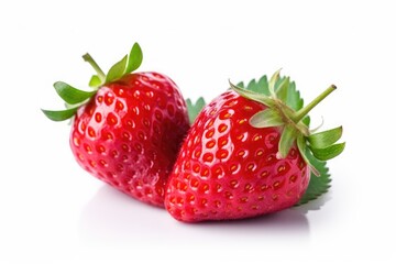 Two fresh, ripe strawberries with green leaves on a white background.