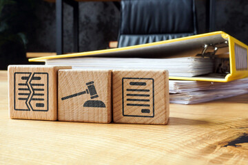 Breach of Contract concept. Cubes and a folder with documents for arbitration. Litigation or...