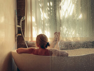 Middle aged woman taking a bath