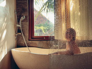 Middle aged woman taking a bath