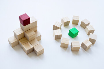 Pyramid and circle of cubes as types of management and leadership. Leader or manager concept.