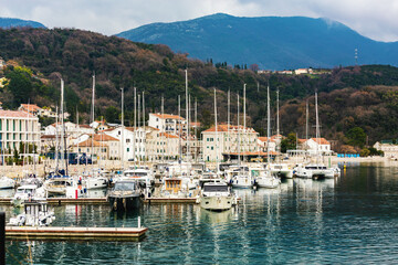 Yachts docked at Risan marina in Kotor Bay, perfect for travel and luxury lifestyle. Risan, Bay of...