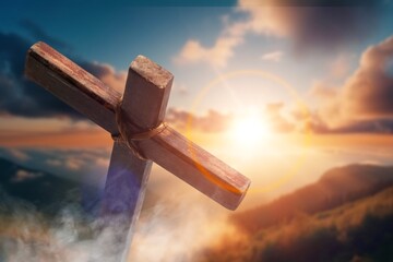 Golgotha hill and wooden cross on sky background