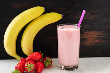 Strawberry and banana smoothie drink, blended cocktail, milkshake in a glass