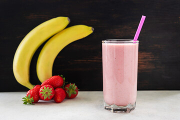 Strawberry and banana smoothie drink, blended cocktail, milkshake in a glass