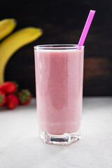 Strawberry and banana smoothie drink, blended cocktail, milkshake in a glass