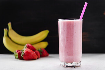 Strawberry and banana smoothie drink, blended cocktail, milkshake in a glass
