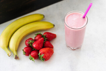 Strawberry and banana smoothie drink, blended cocktail, milkshake in a glass