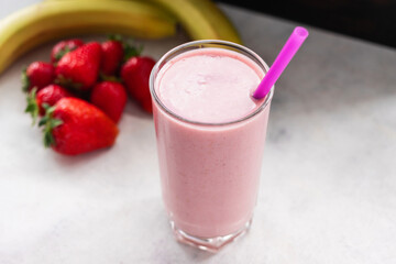 Strawberry and banana smoothie drink, blended cocktail, milkshake in a glass