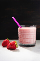 Strawberry smoothie drink, blended cocktail, milkshake in a glass