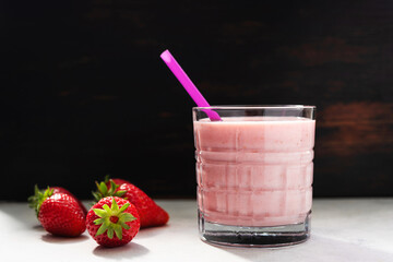 Strawberry smoothie drink, blended cocktail, milkshake in a glass