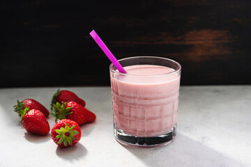 Strawberry smoothie drink, blended cocktail, milkshake in a glass