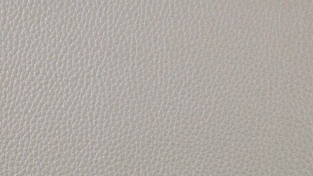 white Leather background texture. Slow camera motion, macro High detailed 4K video. Pattern texture surface panning background.