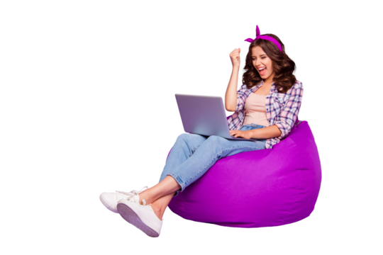Full size portrait of lady in checkered shirt denim jeans her brunette curly wave style stylish hair she sit isolated on violet purple trendy background work on notebook open mouth raised fist up