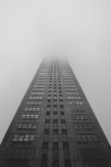 Black and white building in foggy weather.