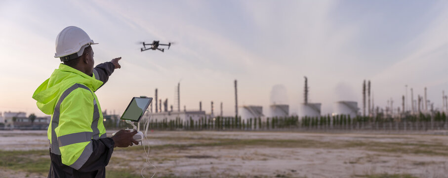 Engineer surveyor team Use drone for operator inspecting and survey construction site. Surveyors or explorer use drones to view construction sites or check security