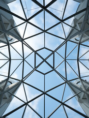 Modern Glass Architecture Against A Blue Sky