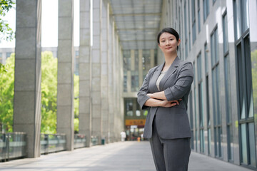 Confident Professional Woman in Urban Business District