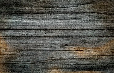 close-up of a wooden surface. Dark natural background