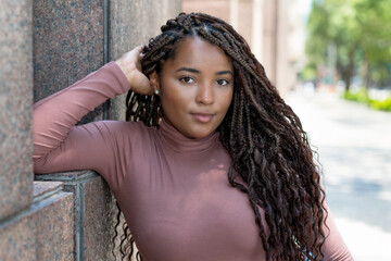 Pretty african american female young adult with braids