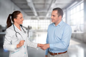 Pharmaceutical sales talking with doctor in clinic