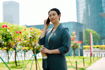 Professional Businesswoman Taking a Call Outdoors