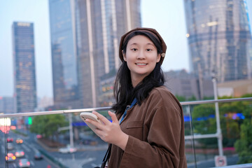 Young Woman Enjoying City Life with Smartphone