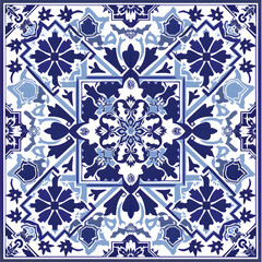 A blue and white tile pattern with flowers and leaves