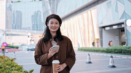 Confident Young Professional Enjoying Coffee Break Outdoors