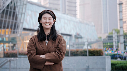 Confident Young Woman Smiling in Urban Environment