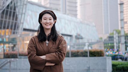 Confident Young Woman Smiling in Urban Environment