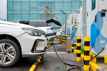 Naklejka premium Electric Vehicles Charging at Modern Charging Station