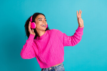 Photo portrait of pretty teen girl headphones dancing wear trendy pink outfit isolated on aquamarine color background