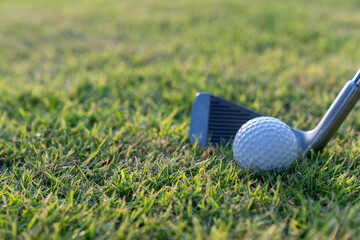 Golf balls on the golf course with golf clubs ready for golf in the first short