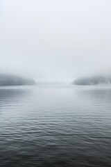 A boat floating on water in misty weather