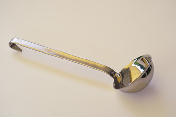 Close-up of isolated metal ladle on photo table outdoor at home terrace at Swiss City of Zürich on a sunny spring afternoon. Photo taken May 20th, 2024, Zurich, Switzerland.