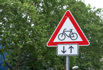 Road sign bicycles crossing the road back and forth