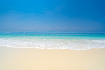 Clean white sandy beach welcoming blue waters on a clear day, Phuket Island, Thailand, Asia